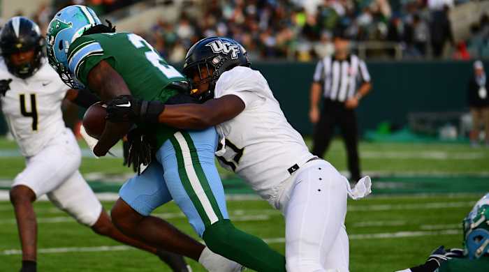 UCF’s Jason Johnson tackles a Tulane player.